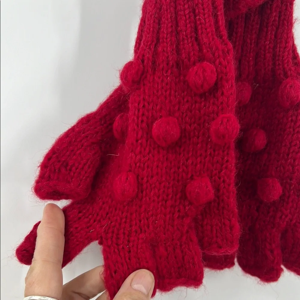 Wooden ships popcorn, fingerless glove with red raised Swiss dot bobble
